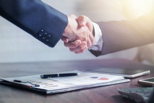 construction meeting shaking hands
